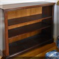F24. Short wooden bookcase. 34"h x 43"w x 14"d 
